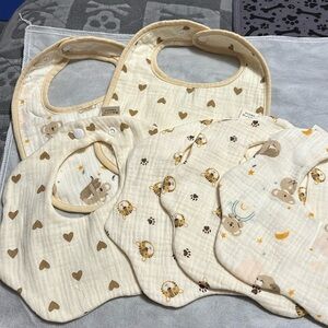 six Muslin bibs